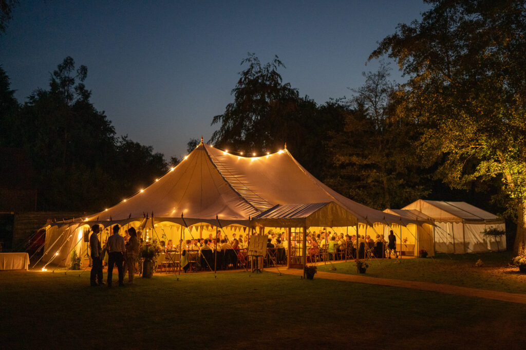 Wedding reception marquee in garden with trees