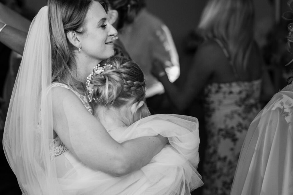 Bride hugging her daughter